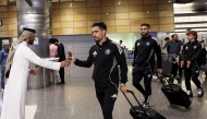 Sharjah players are welcomed upon their arrival in Doha.