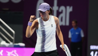 Poland's Iga Swiatek hits a return against Indonesia's Janice Tjen.