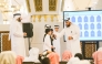 Officials with students during the event at Imam Muhammad bin Abdul Wahhab Mosque.