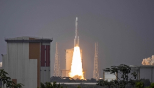 An Ariane 6 rocket carrying 32 satellites for the Amazon Leo constellation launches at the Guiana Space Centre in Kourou, on the French overseas department of Guiana, on February 12, 2026. (Photo by Ronan LIETAR / AFP)