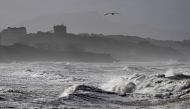 Waves crash near the Plage des Basques in Biarritz, as the storm named Nils hits southwestern France coastline on February 12, 2026. (Photo by Gaizka IROZ / AFP)