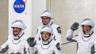 NASA astronauts Jessica Meir (C), commander, and Jack Hathaway (L), pilot, ESA (European Space Agency) astronaut Sophie Adenot (R), and Roscosmos cosmonaut Andrey Fedyaev (2ndL) walk out as they prepare to travel to the SpaceX Falcon 9 rocket with the company's Dragon spacecraft at Space Launch Complex 40 for the Crew-12 mission at Cape Canaveral Space Force Station in Florida, on February 13, 2026. (Photo by Jim WATSON / AFP)