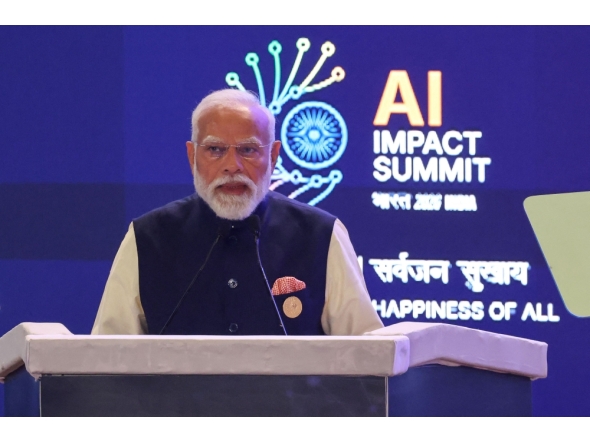 India's Prime Minister Narendra Modi delivers a speech at the AI Impact Summit in New Delhi on February 19, 2026. (Photo by Ludovic Marin / AFP)