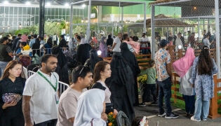 People visiting the exhibition at Katara. 