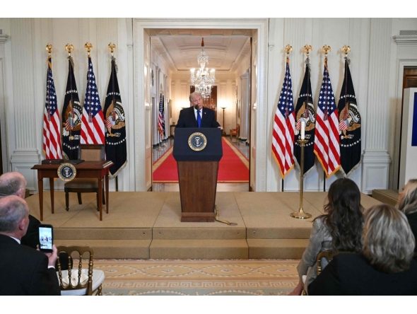 US President Donald Trump speaks during the Angel Families Remembrance Ceremony in the East Room of the White House in Washington, DC, on February 23, 2026. (Photo by SAUL LOEB / AFP)