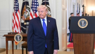 US President Donald Trump reacts as he departs during the Angel Families Remembrance Ceremony in the East Room of the White House in Washington, DC, on February 23, 2026. (Photo by Saul Loeb / AFP)