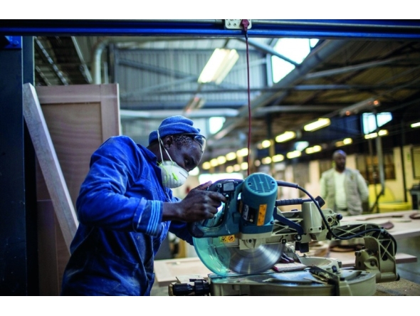 A worker cuts wood at the Furntech Workshop in Johannesburg, South Africa. Representational file photo.