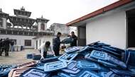 (Files) Election officials inspect ballot boxes before they are dispatched from the Election Commission office in Kathmandu on February 9, 2026 ahead of Nepal's general elections. (Photo by Prakash MATHEMA / AFP)