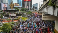 Protesters march during an anti-corruption rally that coincides with the 40th anniversary of the EDSA People Power Revolution, in Quezon City on February 25, 2026. (Photo by Jam Sta Rosa / AFP)