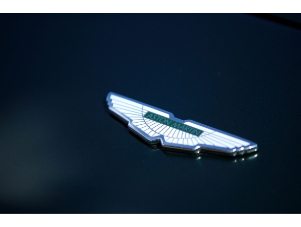 The Aston Martin emblem is pictured during the Concours of Elegance at Hampton Court Palace, south west of London on September 5, 2025. Photo by Rhianna Chadwick / AFP