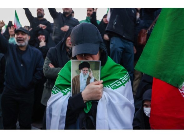 People mourn the death of Iran's supreme leader Ayatollah Ali Khamenei at a square in Tehran on March 1, 2026. (Photo by Atta Kenare / AFP)