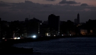 A view of buildings during a blackout in Havana taken on March 4, 2026. (Photo by Yamil Lage / AFP)