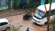 Vehicles move on a flooded road after a heavy rain in Kibera of Nairobi, Kenya, on March 7, 2026. (Photo by Henry Naminde/Xinhua)
