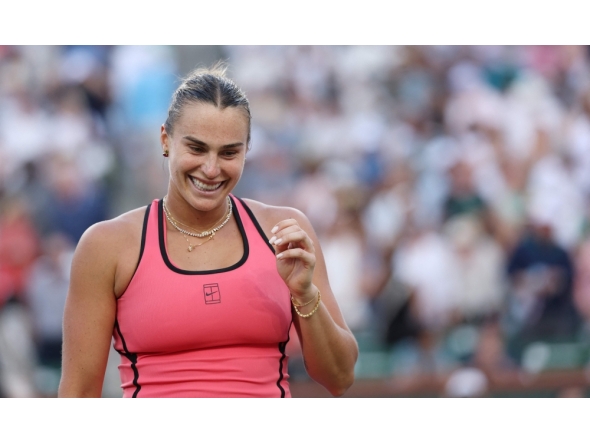 Aryna Sabalenka celebrates match point against Linda Noskova of Czech Republic during their Women's Singles Semifinals match. (Photo by Clive Brunskill/AFP)