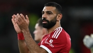 (FILES) Liverpool's Egyptian striker #11 Mohamed Salah applauds the fans following the English Premier League football match between Liverpool and Aston Villa at Anfield in Liverpool, north west England on November 1, 2025.  (Photo by Paul ELLIS / AFP)