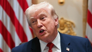 US President Donald Trump speaks during a cabinet meeting in the Cabinet Room of the White House on March 26, 2026. (Photo by Jim WATSON / AFP)
