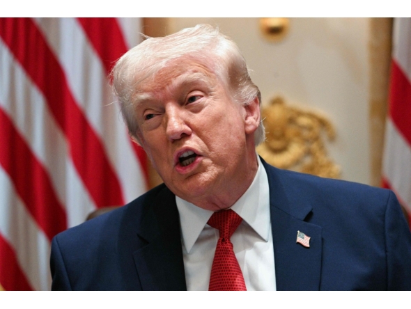 US President Donald Trump speaks during a cabinet meeting in the Cabinet Room of the White House on March 26, 2026. (Photo by Jim WATSON / AFP)
