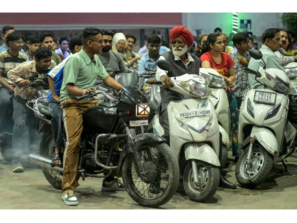 People rush to refuel their vehicles at a fuel station in Amritsar on March 26, 2026 following import disruptions caused by the Middle East conflict. Photo by Narinder NANU / AFP