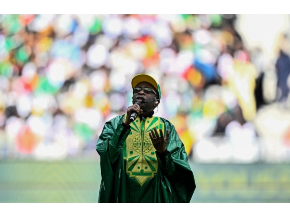 Sengalese musician Youssou N'Dour performs ahead of the international friendly football match between Senegal and Peru at the Stade de France in Saint-Denis, north of Paris on March 28, 2026. (Photo by Julien De Rosa / AFP)