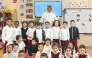 Undersecretary of the Ministry of Education and Higher Education Dr. Ibrahim bin Saleh Al-Nuaimi with pupils at a school. 
