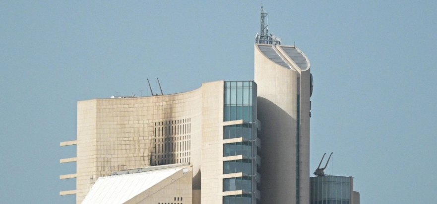 This photograph shows the impact of a fire caused by a drone attack on a building of the Kuwait Petroleum Corporation (KPC), in Kuwait City on April 5, 2026. (Photo by AFP)
