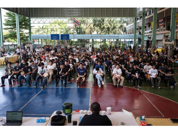 A group of men wait for the drawing of the Thai military conscription lottery at Watmatchantikaram School in Bangkok on April 7, 2026. (Photo by Chanakarn Laosarakham / AFP)