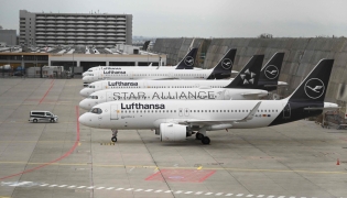 Planes operated by German airline Lufthansa sit on the tarmac at Frankfurt Airport in Frankfurt am Main, on April 10, 2026 as cabin crews went on strike over an ongoing labour dispute. (Photo by Kirill KUDRYAVTSEV / AFP)
