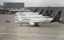 Planes operated by German airline Lufthansa sit on the tarmac at Frankfurt Airport in Frankfurt am Main, on April 10, 2026 as cabin crews went on strike over an ongoing labour dispute. (Photo by Kirill KUDRYAVTSEV / AFP)