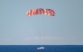 This handout photo released by NASA shows NASA's Orion spacecraft as it lands in the Pacific Ocean off the coast of California, on April 10, 2026. (Photo by Bill INGALLS / NASA / AFP) 