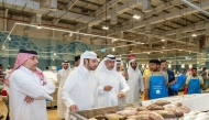 Minister of Municipality H E Abdullah bin Hamad bin Abdullah Al Attiyah with other officials during their visit to Umm Salal Central Market.