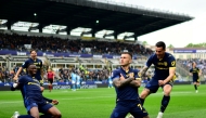 Parma's Argentinan forward #07 Gabriel Strefezza (C) celebrates after scoring a goal during the Italian Serie A football match between Parma Calcio 1913 and SSC Napoli at the Ennio Tardini Stadium in Parma on April 12, 2026. (Photo by MARCO BERTORELLO / AFP)