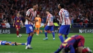 Atletico Madrid's Argentine forward #19 Julian Alvarez (C) and teammates celebrate at the end of the UEFA Champions League quarter final second leg football match between Club Atletico de Madrid and FC Barcelona at Metropolitano Stadium in Madrid on April 14, 2026. (Photo by Thomas COEX / AFP)
