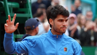 Spain's Carlos Alcaraz gestures after the Monte Carlo ATP Masters Series Tournament final tennis match against Italy's Jannik Sinner on Court Rainier III at the Monte-Carlo Country Club in Roquebrune-Cap-Martin, south-eastern France on April 12, 2026. (Photo by Valery HACHE / AFP)
