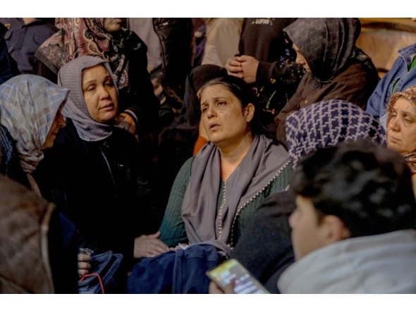 Families of victims wait in front of a hospital in Kahramanmaras, on April 15, 2026, after a teenager opened fire in a school in the city.  (Photo by Orhan Erkilic / AFP)