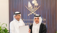 Minister of Justice and Minister of State for Cabinet Affairs  H E Ibrahim bin Ali Al-Mohannadi with a lawyer. 