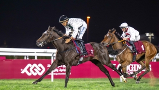 Samha Alseej, ridden by Arnaud de Lepine, leads the field during the feature. PIC: Juhaim/QREC
