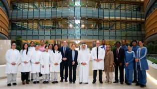 Dr. Chiara Cugno (centre) with the Hematology and Oncology and GMP facility teams at Sidra Medicine. 