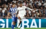 Real Madrid's English midfielder #05 Jude Bellingham fights for the ball with Alaves' Spanish midfielder #04 Denis Suarez during the Spanish league football match between Real Madrid CF and Deportivo Alaves at the Santiago Bernabeu stadium in Madrid on April 21, 2026. (Photo by Pierre-Philippe MARCOU / AFP)