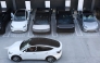 Tesla electric vehicles, including the Cybertruck, charge at stations during the opening of the Tesla Diner and Drive-In restaurant and Supercharger on Santa Monica Blvd in the Hollywood neighborhood Los Angeles, California on July 21, 2025. Photo by Patrick T. Fallon / AFP