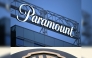 (COMBO) This combination of files pictures created on December 22, 2025 shows the Paramount logo (TOP) displayed at Columbia Square along Sunset Blvd in Hollywood, California on March 9, 2023 and the WB logo on the exterior of Warner Bros. Studios, Burbank in Burbank, California on October 21, 2025. Photo by Patrick T. Fallon and Robyn Beck / AFP