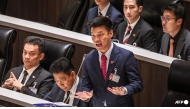 People's Party leader Natthaphong Ruengpanyawut (centre) speaks at the parliament chamber in Bangkok on Apr 9, 2026. (File photo: AFP/Chanakarn Laosarakham)