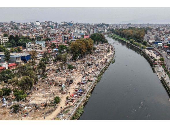 NEPAL-POLITICS-RIGHTS
An aerial view shows squatter settlements demolished by Nepali authorities along the banks of the river Bagmati in Kathmandu on April 25, 2026. (Photo by Prabin Ranabhat / AFP)