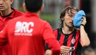 AC Milan's Croatian midfielder #14 Luka Modric leaves the pitch after being injured during the Italian Serie A football match between AC Milan and Juventus FC at the San Siro stadium in Milan, northern Italy, on April 26, 2026. (Photo by Stefano RELLANDINI / AFP)