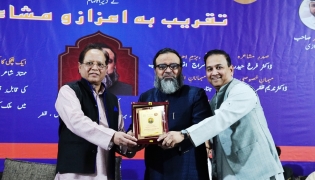 Poet Nadeem Maher being honoured at the event.
