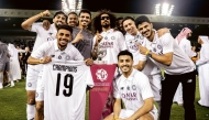 Al Sadd players celebrate their QSL title on Monday.