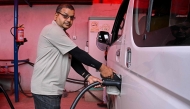 NEPAL-TRANSPORT-AUTOMOBILE-ENERGY
Electric microbus driver Purushottam Adhikari charges his vehicle at a charging station in Kathmandu on May 1, 2026. As global fuel markets reel from the Middle East war, motorists in Nepal are increasingly turning to electric vehicles, with high demand putting a strain on dealerships. 
(Photo by Prakash MATHEMA / AFP) / TO GO WITH 'Nepal-Transport-Automobile-Energy' FOCUS