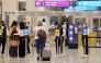 (FILES) A picture shows passengers walking towards the gates at terminal 3 at Dubai international Airport, in the Gulf emirate of Dubai, on August 16, 2022.
(Photo by Giuseppe Cacace / AFP)