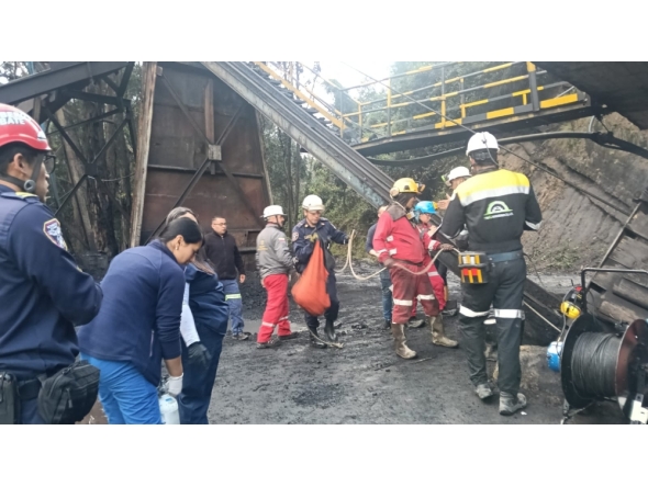 This handout picture released by the Cundinamarca Fire Department shows firefighters inspecting the site of an explosion at a coal mine in Sutatausa, Cundinamarca department, Colombia on May 4, 2026.
 Photo by Handout / Cundinamarca Fire Department / AFP