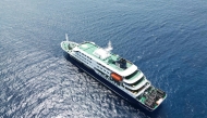 This aerial picture shows a general view of the cruise ship MV Hondius stationary off the port of Praia, the capital of Cape Verde, on May 4, 2026. Photo by AFP
