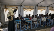 Displaced Sudanese students attend a class at an elementary school, south of Port Sudan, on April 26, 2026. Photo by Khaled Desouki / AFP
